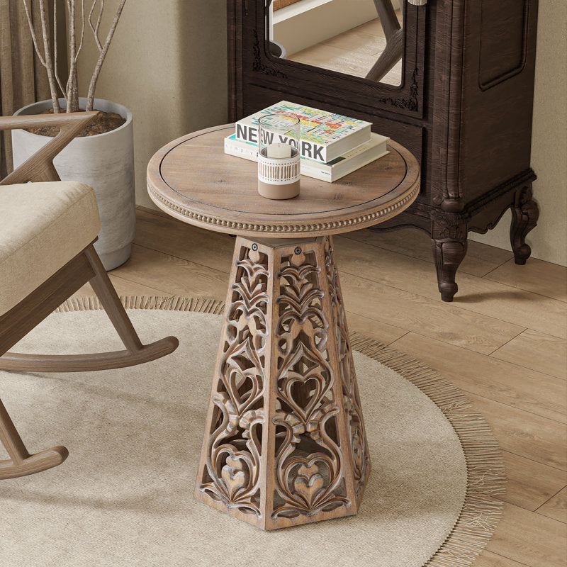 Round teak wood end table with intricate hand carving