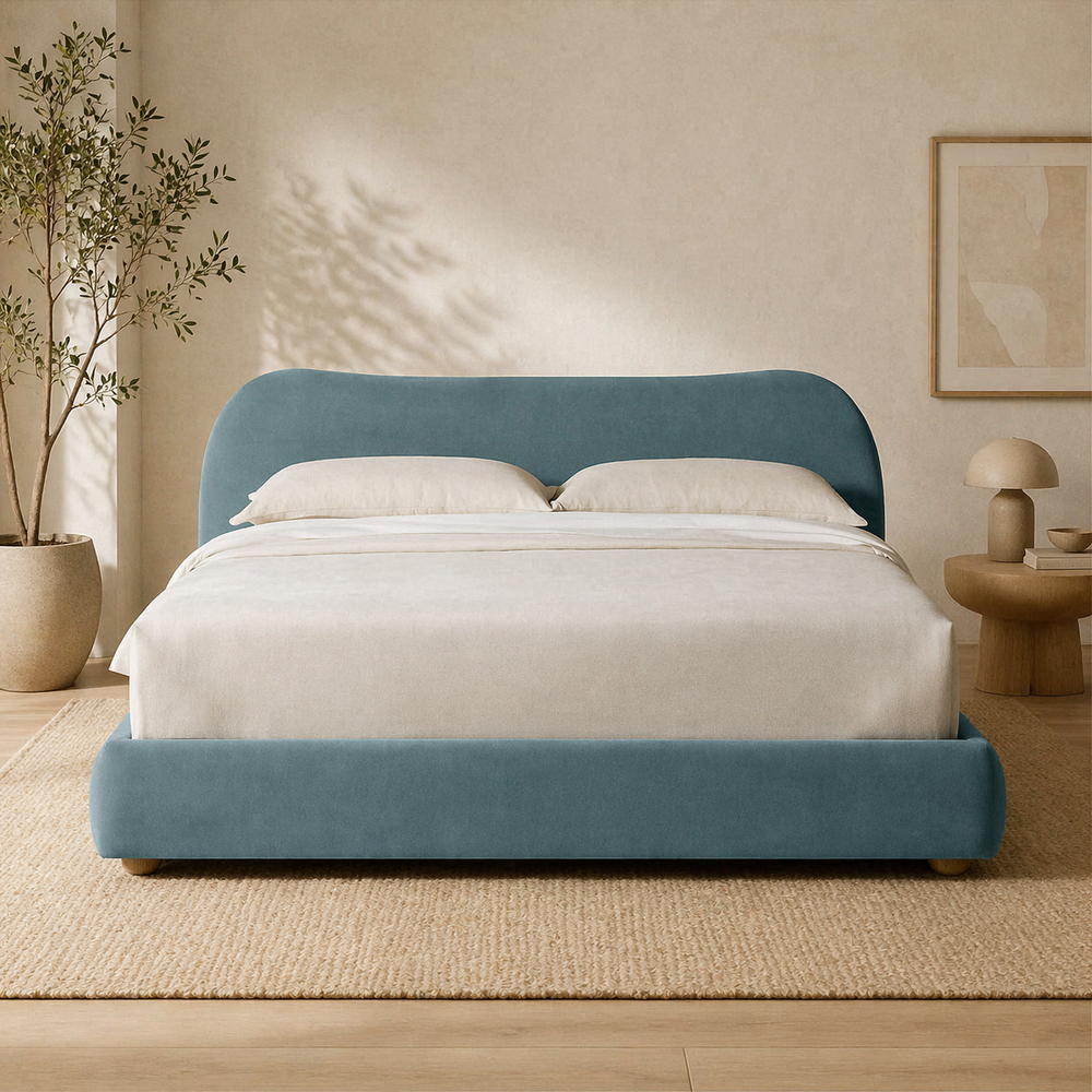 Luxury teal upholstered bed with teak wood frame