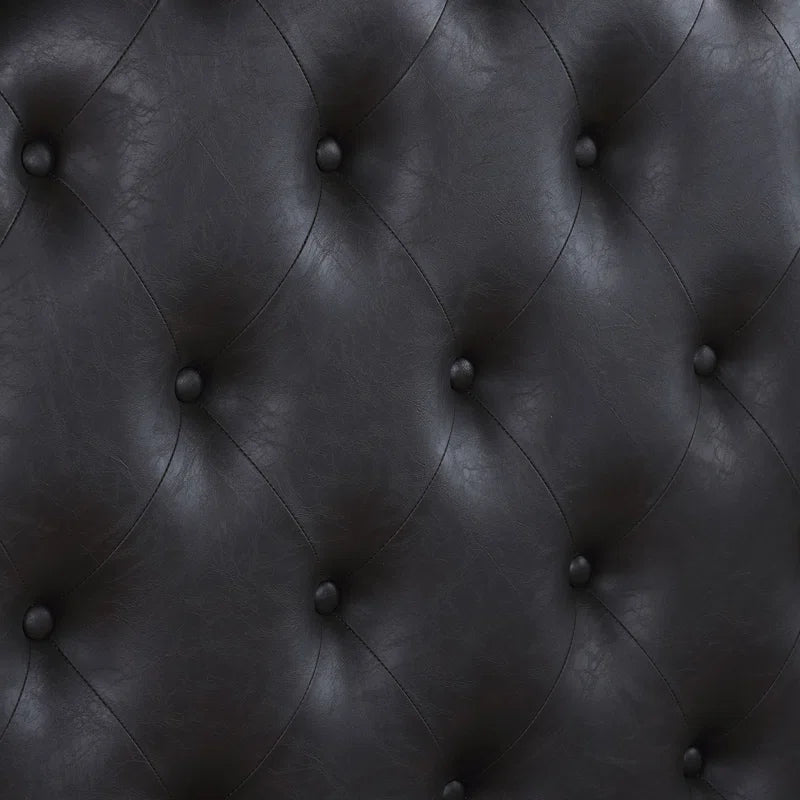 dark wood bed with button tufted headboard