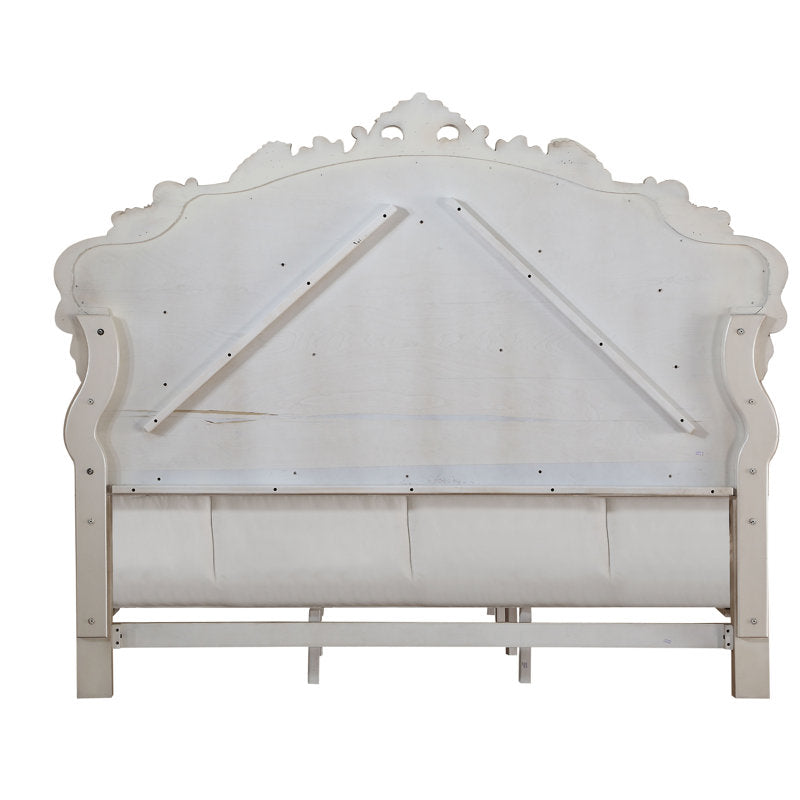 Elegant carved wooden bed for master bedroom