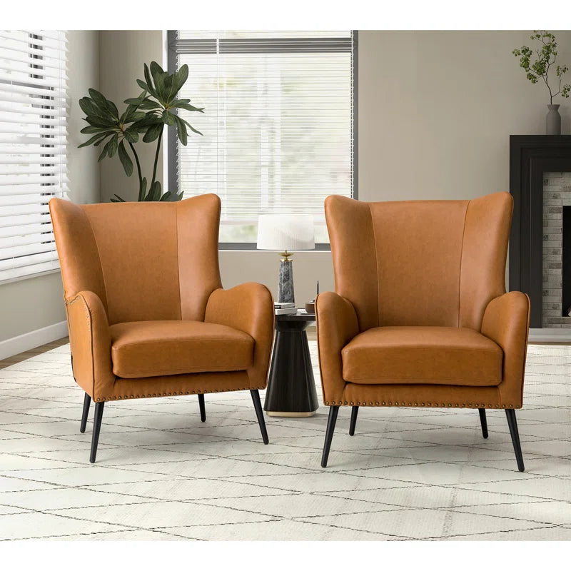 Modern tan leather accent chairs with teak wood frame