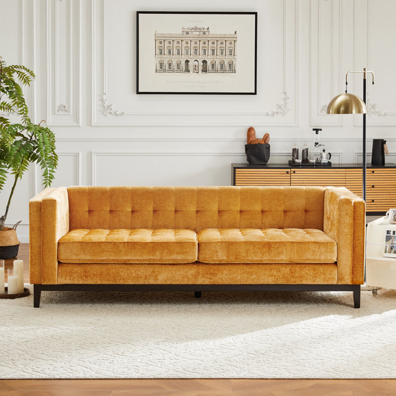 Luxury velvet sofa with teak wood frame and button tufting