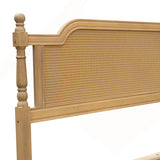 vintage wooden bed with woven cane design